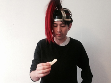 Dean Kissick eating cheese in a hat