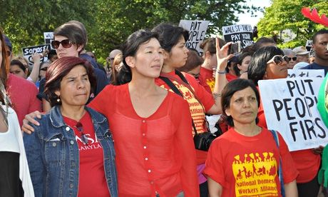 Ai-Jen Poo (centre) and members of the National Domestic Workers Alliance march
