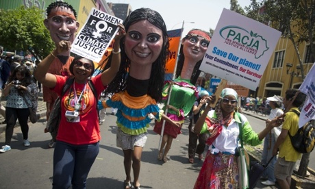 A girl takes part in the Peoples Climate March on the sidelines of the UN COP20 and CMP10 climate change conferences being held in Lima on December 10, 2014. The UN 20th session of the Conference of the Parties on Climate Change (COP20), and the 10th session of the Conference of the Parties serving as the Meeting of the Parties to the Kyoto Protocol (CMP10) entered its second week of negotiations until 12th.