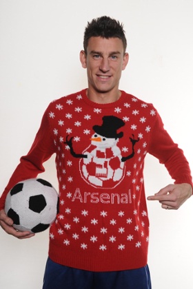 ***EMBARGOED UNTIL 0001 TUESDAY DECEMBER 9, 2014***  Handout photo provided by Save The Children of Arsenal's Laurent Koscielny wearing Save The Children Chhristmas Jumpers. Issue date: Monday December 8, 2014. See PA story SOCCER Arsenal. Photo credit should read: Save The Children/PA Wire. NOTE TO EDITORS: This handout photo may only be used in for editorial reporting purposes for the contemporaneous illustration of events, things or the people in the image or facts mentioned in the caption. Reuse of the picture may require further permission from the copyright holder.
