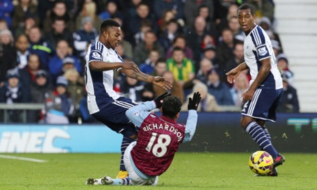 Kieran Richardson slides in on West Bromwich Albion's Stephane Sessegnon ...