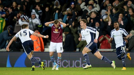 Craig Gardner, second right, wheels away in celebration after breaking the deadlock.