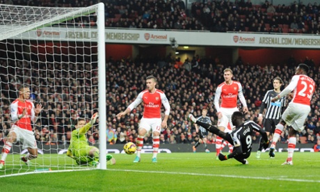 Pappis Cisse is denied an equalizer by the legs of Wojciech Szczesny.