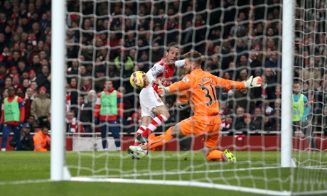 Santi Cazorla makes it two with a delicious little chip.
