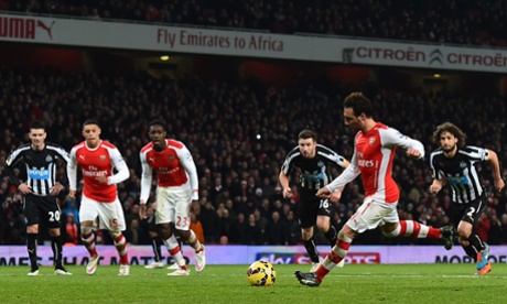 The Arsenal midfielder steps up to the penalty spot ...