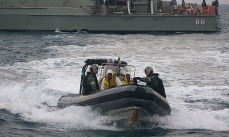 Australian navy personnel transfer Afghanistan asylum-seekers to a Indonesian rescue boat near Panaitan island, West Java on August 31, 2012 after the refugee's boat sunk.  Afghans were among the 54 survivors from an asylum-seeker boat that disappeared two days ago off the Indonesian coast, but hopes of finding about 100 more missing were fading fast. The Australia-bound wooden boat carrying about 150 people including children sent a distress signal early on the morning of August 29. It was about eight nautical miles from the main Indonesian island of Java.                AFP PHOTO        (Photo credit should read AFP/AFP/GettyImages)HORIZONTAL|ASYLUMSEEKER|REFUGEE|MAN|BOATPEOPLE|EMERGENCYSERVICES|EVACUATION|SURVIVOR|SHIPWRECK