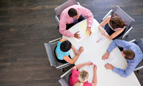 Five businesspeople at boardroom table