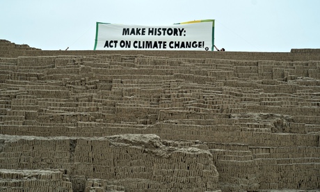 'Make history: act on climate change' banner at the archaeological site of Huaca Pucllana in Lima ad