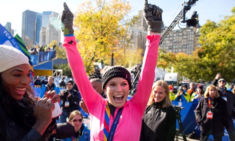 Caroline Wozniacki celebrates after completing the New York marathon, supported by Serena Williams.