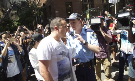 15 Dec 2014, Sydney, Australia --- Sydney, Australia. 15th December 2014 -- Police move on Australian Defence League leader Ralph Cerminara as he speaks out over an ongoing siege in Martin Place, Sydney.