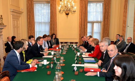 David Cameron sits opposite Scotland's first minister Nicola Sturgeon (in red) before the start of a joint ministerial committee meeting inside 10 Downing Street, London.