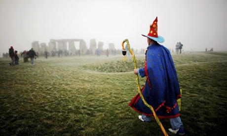 A solstice participant makes his way to Stonehenge.