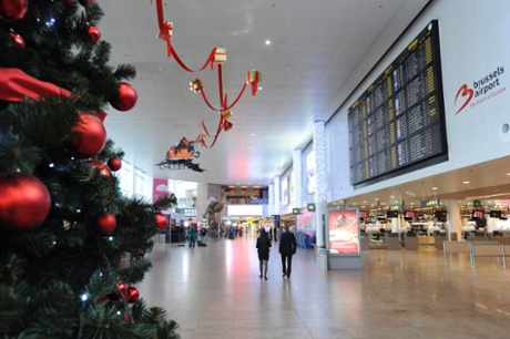 People walk in the hall of departures at Brussels Airport in Zaventem, during a national strike in a protest over the government's planned pension reform and budget cuts December 15, 2104.