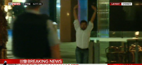 A hostage flees the cafe.