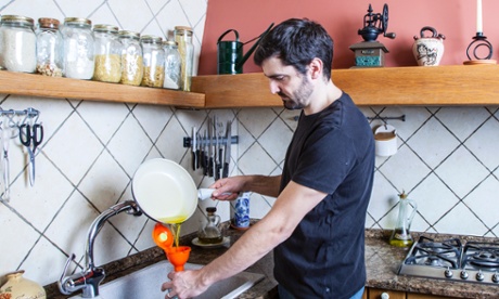 Man pouring fat into an EkoFunnel to turn waste oil into biofuel and prevents blockage