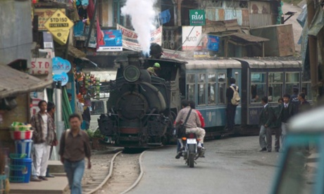 Modern-day explorer: Angus’s book India’s Disappearing Railways is a homage to the country he grew up in.