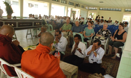Final blessings are paid to Angus at the funeral home.