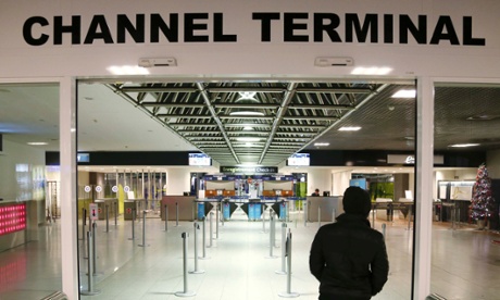 A stranded passenger enters an empty Eurostar departure hall at Midi/Zuid station in Brussels, during a nationwide strike.