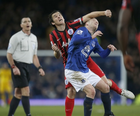 Steven Naismith tangles with Joey Barton and his elbow.