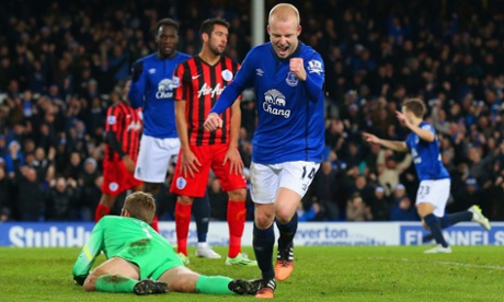 Despair for QPR as Everton's Steven Naismith celebrates scoring their third.