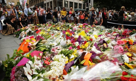 Flowers are left as a sign of respect at Martin Place.
