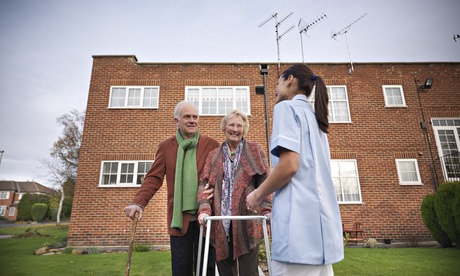Nurse and older couple outdoors
