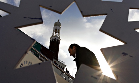A man arrives for Friday prayers at the central Mosque in Birmingham