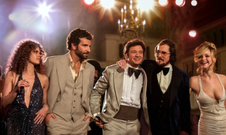 Bradley Cooper, second left, in a scene from American Hustle