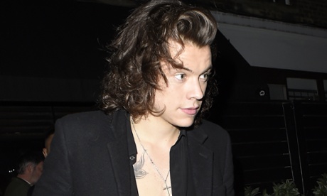 Harry Styles flashes a bit of chest in December