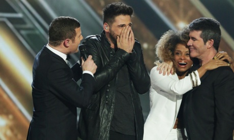 Ben Haenow celebrates on stage after The X Factor final on Sunday