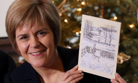 Scotland's First Minister Nicola Sturgeon unveils her Christmas card during the a visit to Glasgow School of Art, where she viewed the fire damage and the artifacts being recovered