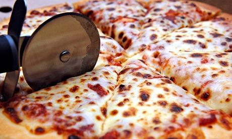 Pizza being sliced