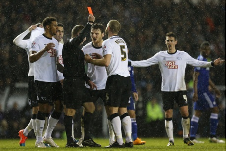 Disbelief at the iPro Stadium as Derby's Jake Buxton is shown a red card by referee Jon Moss