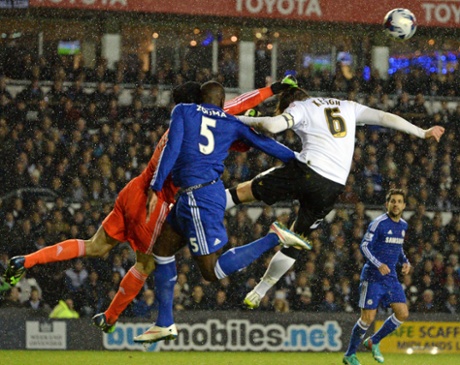 Kurt Zouma clashes heads with Petr Cech whilst under pressure from Derby’s Richard Keogh.