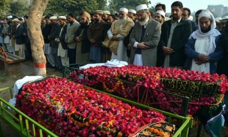Sirajul Haq (third from right), head of the Islamic political party Jamat-e-Islami, leads the funeral prayers of two schoolboys who were killed by Taliban militants at an army-run school in Peshawar.