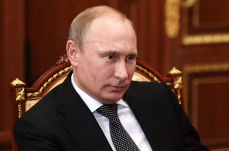 Russian president Vladimir Putin seen yesterday during a meeting with the president of the Russian Chamber of Commerce and Industry, Sergei Katyrin (R) on December 16, 2014 in Moscow, Russia.