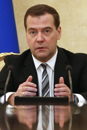 Russias Prime Minister Dmitry Medvedev chairs a meeting with representatives of the government finance and economy units, Central Bank management, management of major fuel, energy and metal companies in Moscow on December 17, 2014.