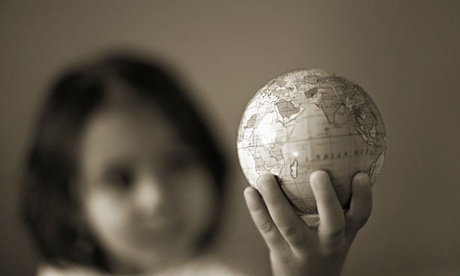 Little girl holds world in hand