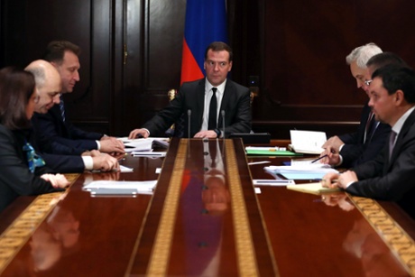 Russia's prime minister Dmitry Medvedev (C) holds a meeting on financial and economic situation of the Far East Federal District at Gorki residence on December 16, 2014 in Moscow, Russia.