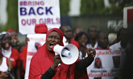 Protesters march to the Nigerian presidential villa.