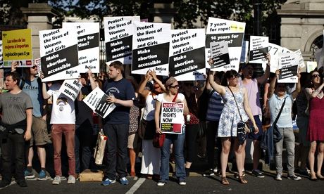 Pro-Choice supporters hold placards in f
