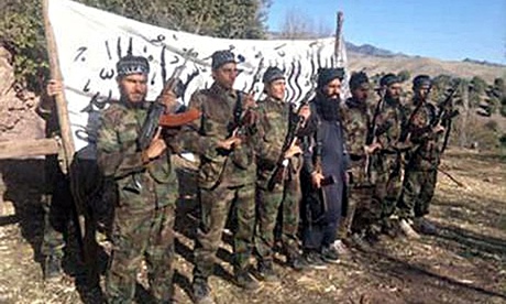 An image released by the Pakistan Taliban purports to show militants responsible for the massacre