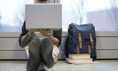 man face hidden by laptop