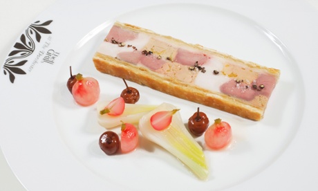 The pâté en croûte next to bits of fruit