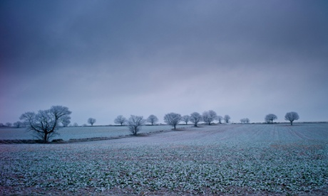 Hoar frost on trees and fields in wintry landscape in The Cotswolds, Oxfordshire
