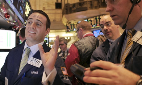 Traders at the New York Stock Exchange as markets surge. Photo: Seth Wenig/AP.