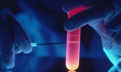 A technician extracts millions of nucleotides from a plastic centrifuge tube