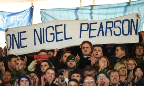 Leicester fans hold up a banner in support of Nigel Pearson.