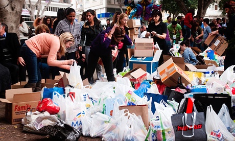 Volunteers help collect canned goods and other food items for a food bank