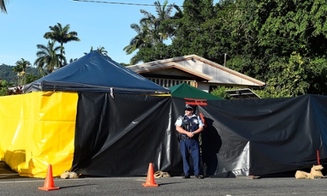 Policeman guards the scene of the multiple stabbing in the suburb of Manoora.